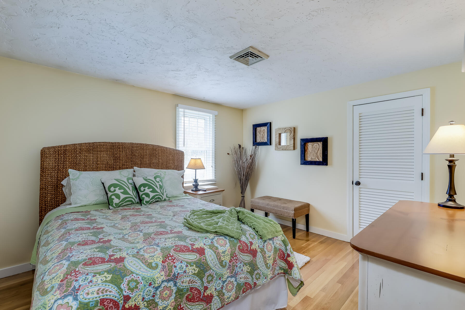 25 Peach Tree Road Marstons Mills, MA 02648 - Photo 18 of 33 a bedroom with a bed and wooden floor