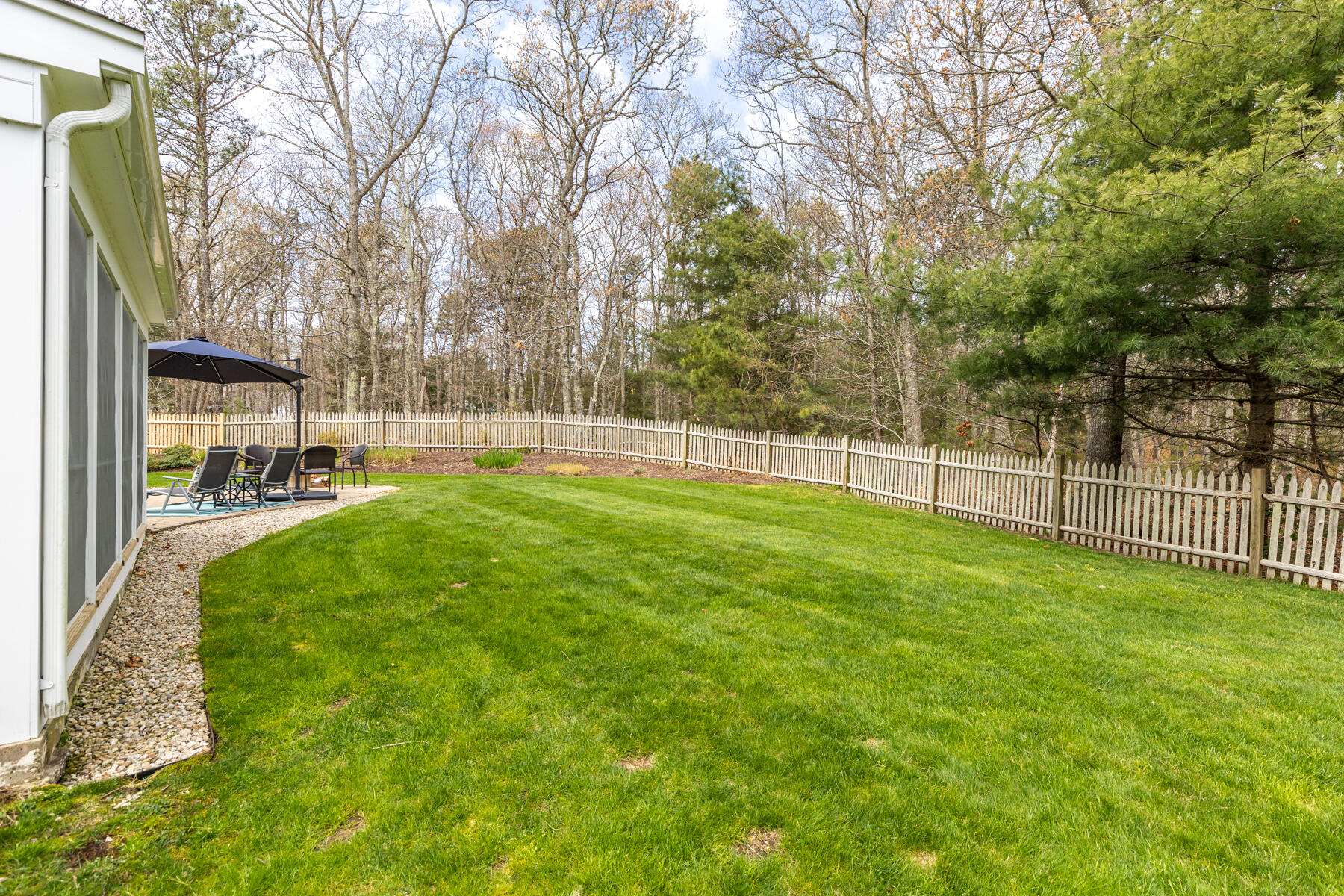 25 Peach Tree Road Marstons Mills, MA 02648 - Photo 23 of 33 a view of a yard with a trees