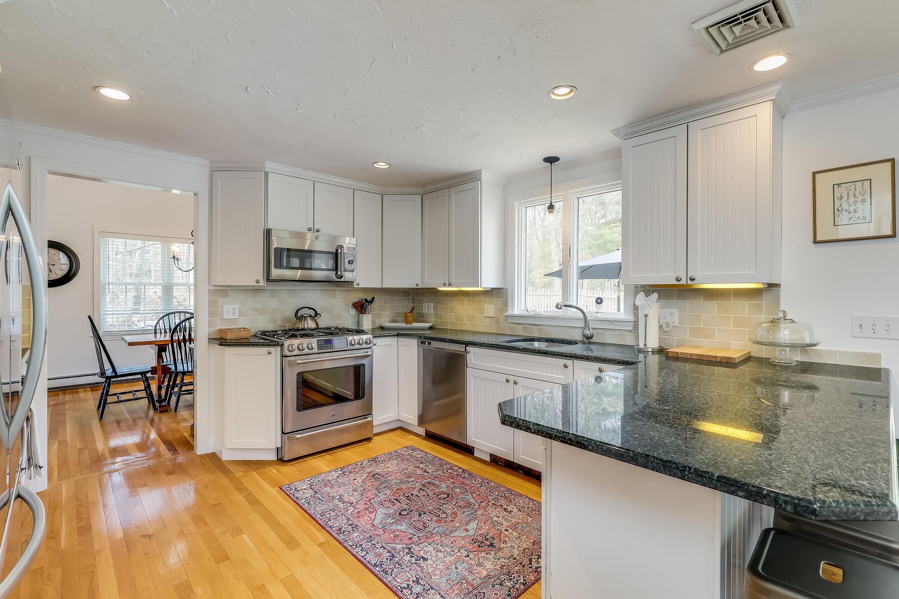 25 Peach Tree Road Marstons Mills, MA 02648 - Photo 3 of 33 a kitchen with a sink a counter top space and stainless steel appliances
