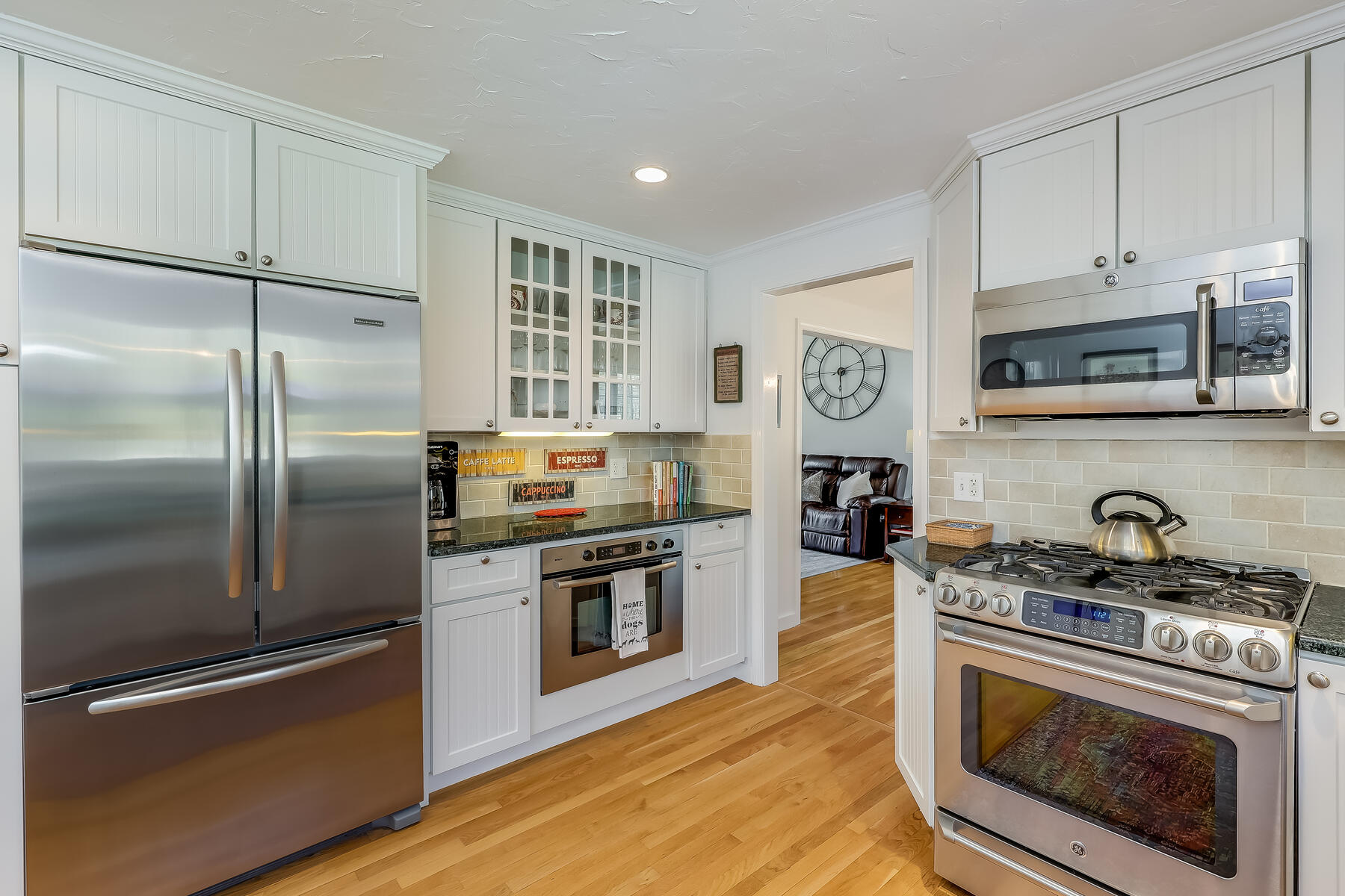 25 Peach Tree Road Marstons Mills, MA 02648 - Photo 4 of 33 a kitchen with stainless steel appliances granite countertop a stove a refrigerator and a microwave