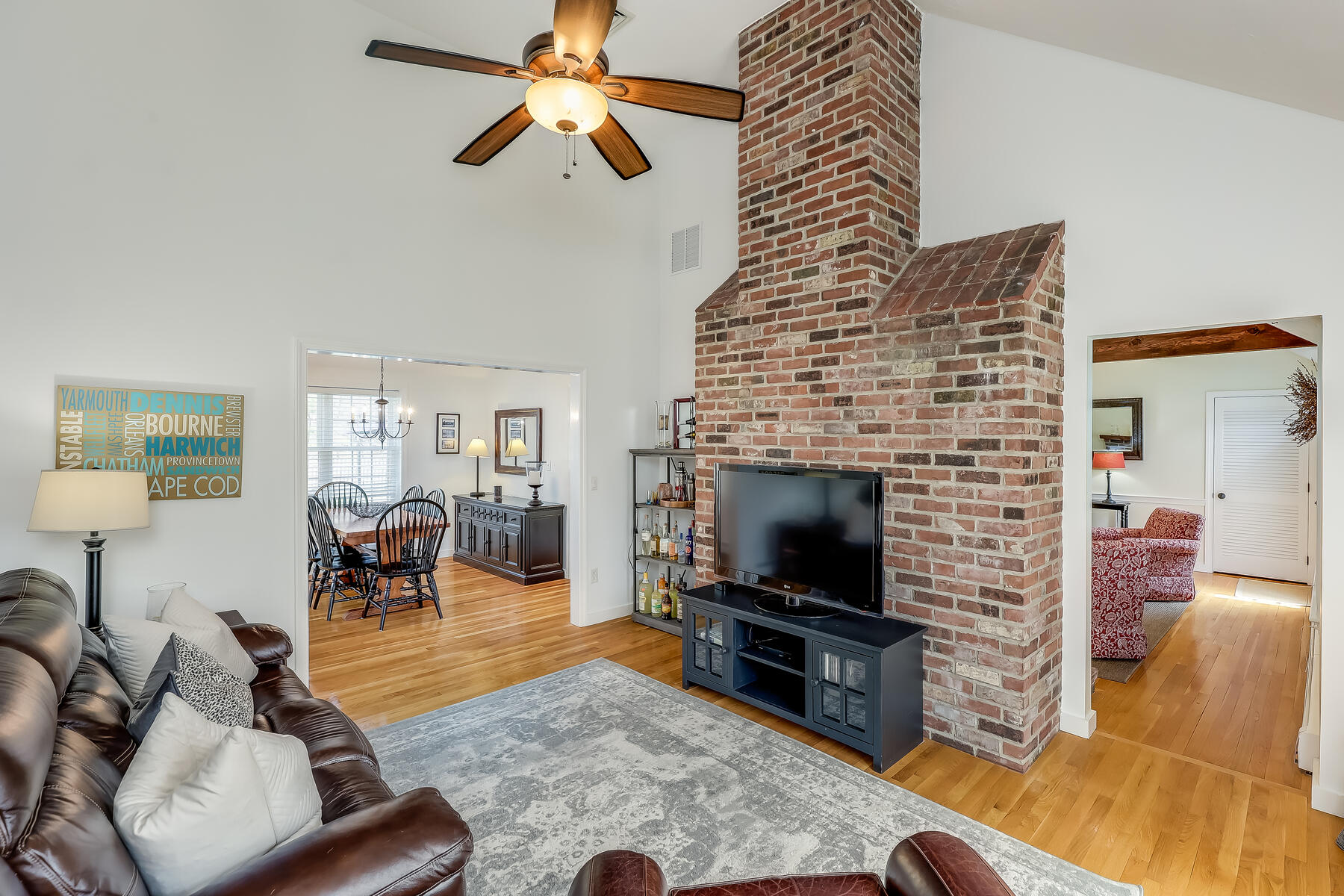 25 Peach Tree Road Marstons Mills, MA 02648 - Photo 10 of 33 a living room with furniture and a fireplace