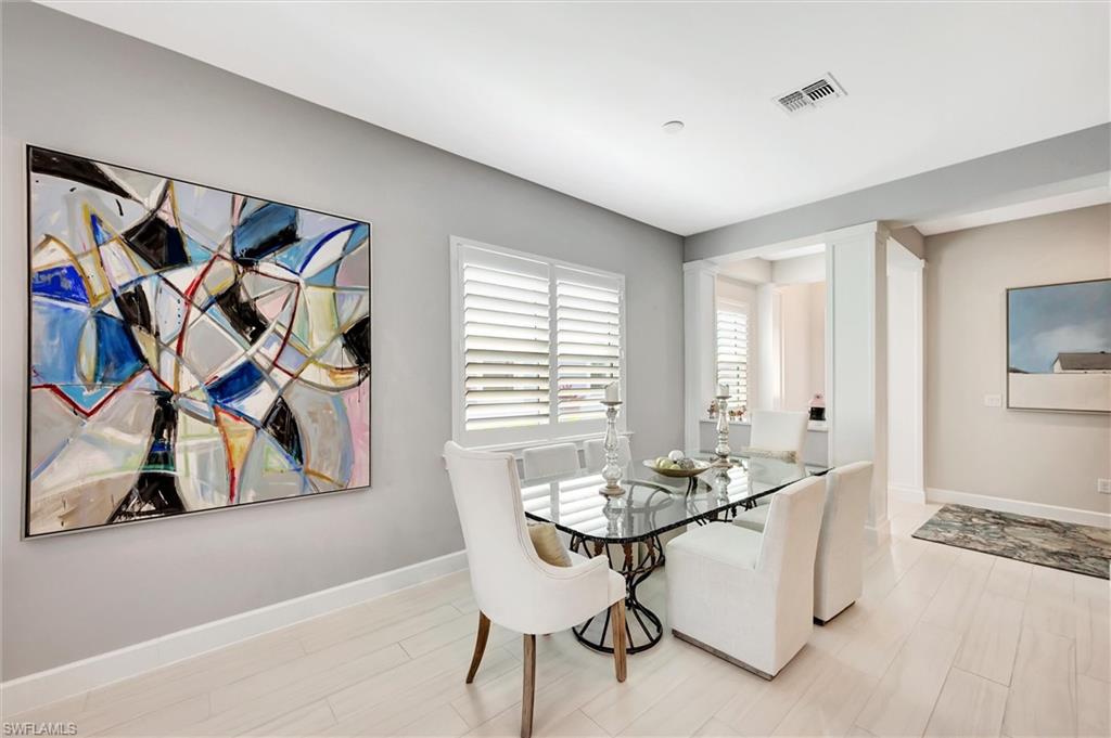 5743 Highbourne Drive Naples, FL 34113 - Photo 25 of 27 a dining room with furniture and window
