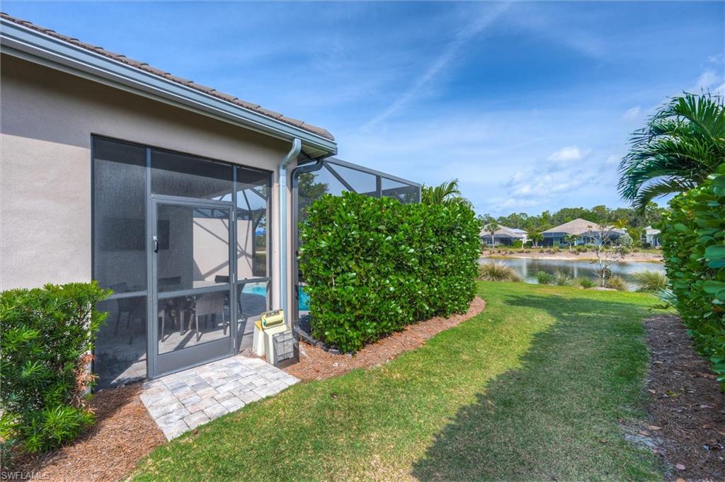 5743 Highbourne Drive Naples, FL 34113 - Photo 4 of 27 a backyard of a house with lots of green space