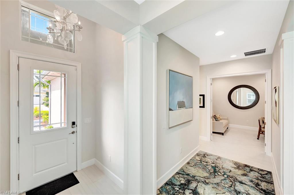 5743 Highbourne Drive Naples, FL 34113 - Photo 5 of 27 a bedroom with a bed and a window