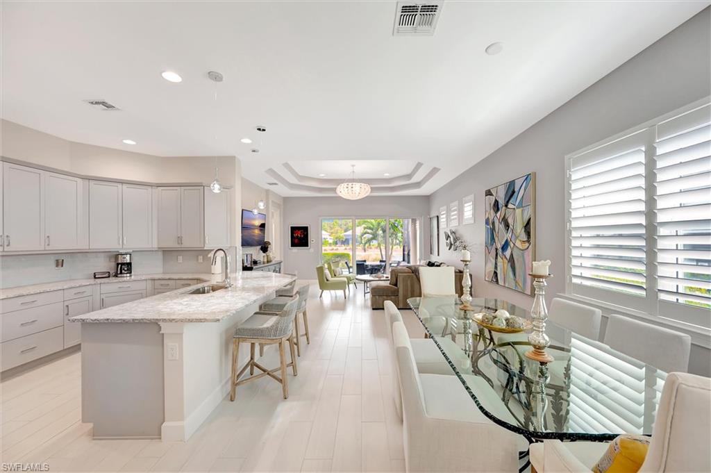 5743 Highbourne Drive Naples, FL 34113 - Photo 6 of 27 a view of a kitchen and dining room