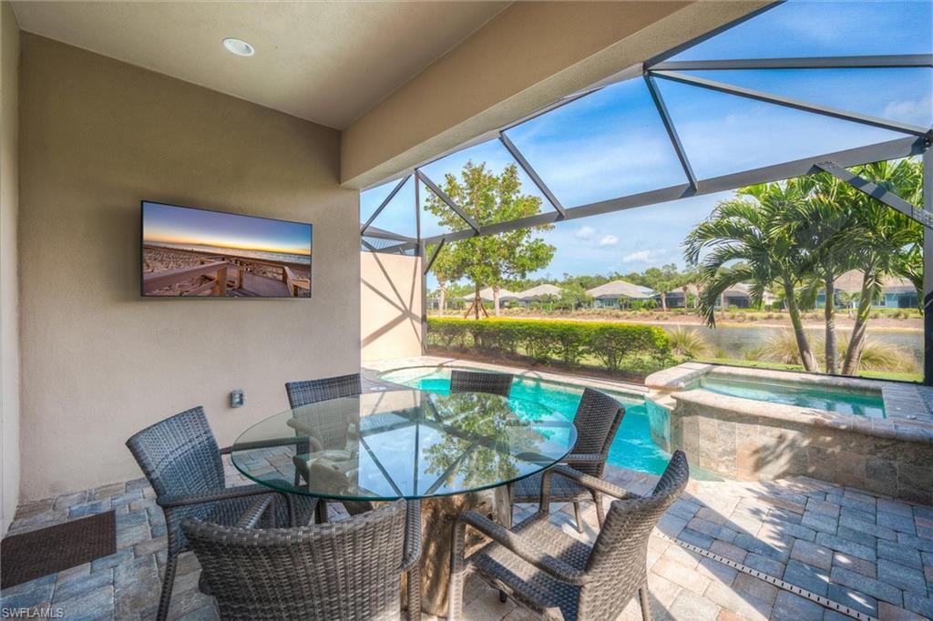 5743 Highbourne Drive Naples, FL 34113 - Photo 10 of 27 a view of a dining room with furniture window and outside view
