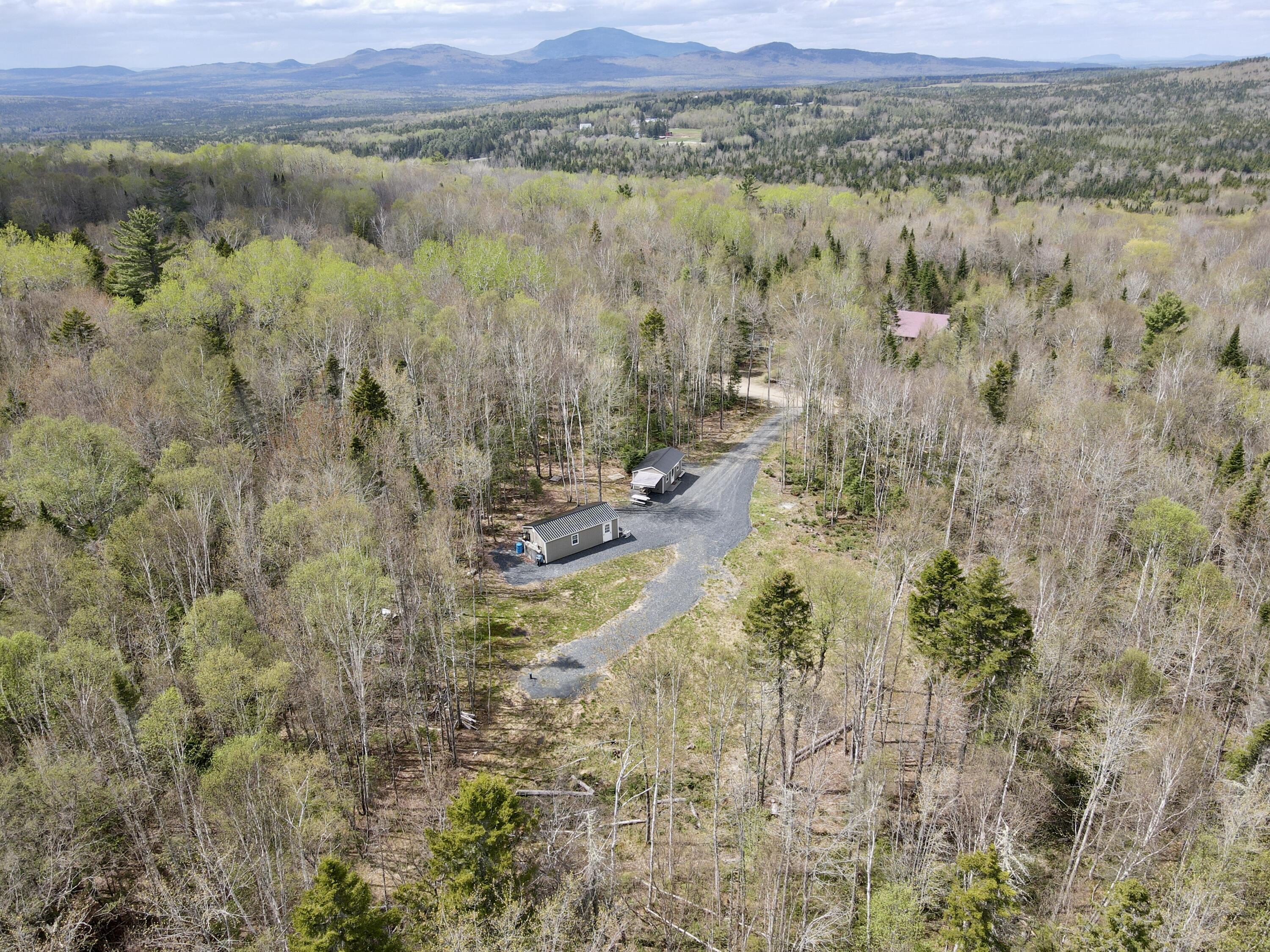 73 Oak Ridge Road Shirley, ME 04485 - Photo 2 of 28 dji_fly_20250515_140448_459_174733229667