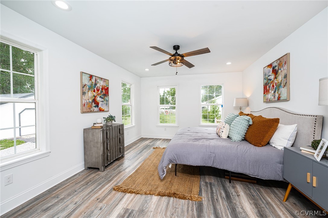 217 Henry Clay Road Ashland, VA 23005 - Photo 18 of 38 a bedroom with a bed and wooden floor
