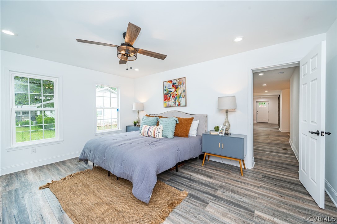 217 Henry Clay Road Ashland, VA 23005 - Photo 19 of 38 a bedroom with a bed and wooden floor