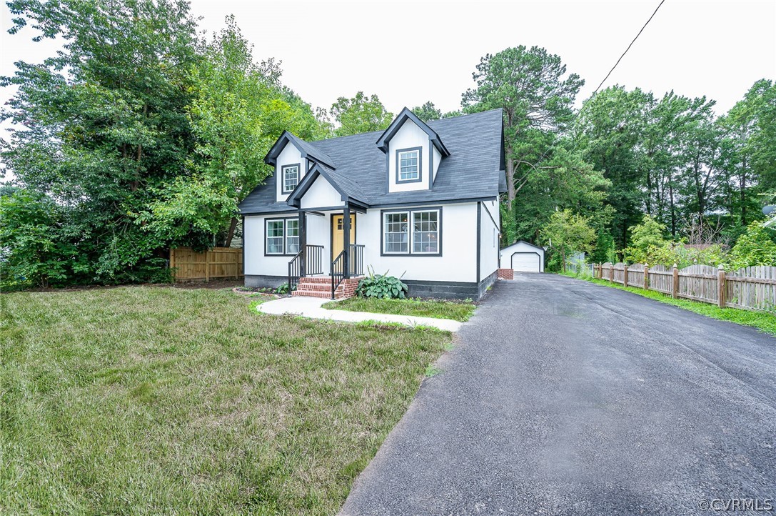 217 Henry Clay Road Ashland, VA 23005 - Photo 2 of 38 a front view of a house with a yard