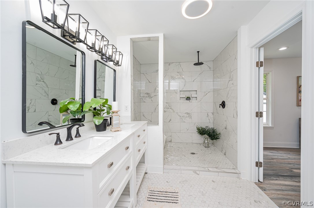 217 Henry Clay Road Ashland, VA 23005 - Photo 21 of 38 a bathroom with a double vanity sink and shower