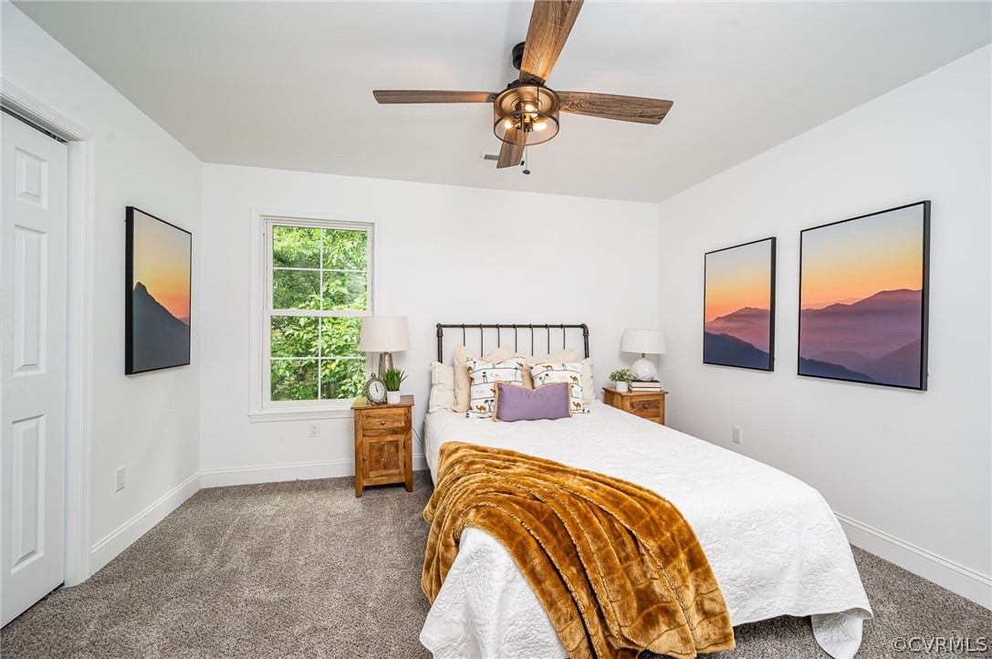 217 Henry Clay Road Ashland, VA 23005 - Photo 26 of 38 a bedroom with a bed and a painting on the wall