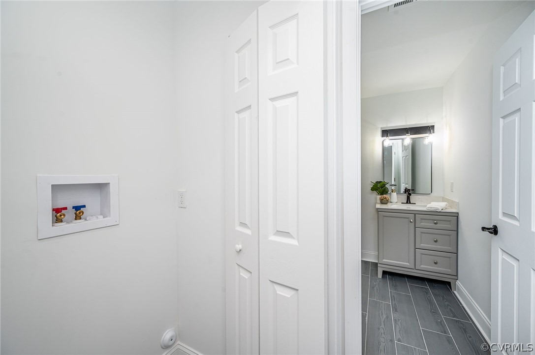 217 Henry Clay Road Ashland, VA 23005 - Photo 28 of 38 a bathroom with a sink and a mirror