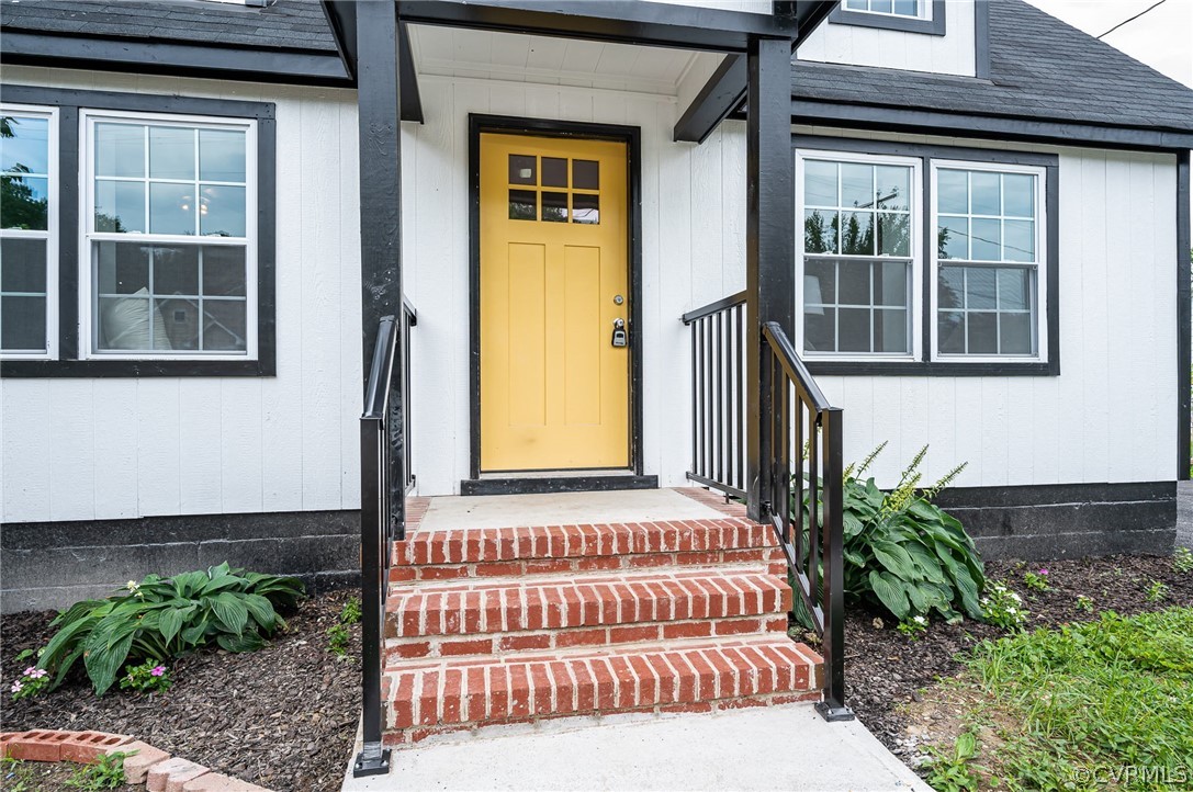 217 Henry Clay Road Ashland, VA 23005 - Photo 3 of 38 a front view of a house with a garden
