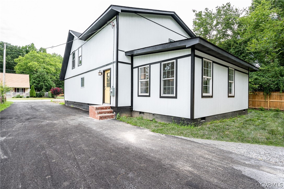 217 Henry Clay Road Ashland, VA 23005 - Photo 35 of 38 a view of a house with backyard and trees