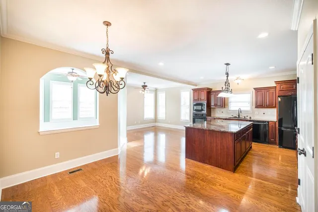 a view of a kitchen with granite countertop lots of counter top space