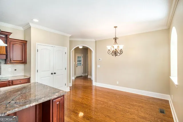 a view of a kitchen with granite countertop cabinets a sink and dishwasher