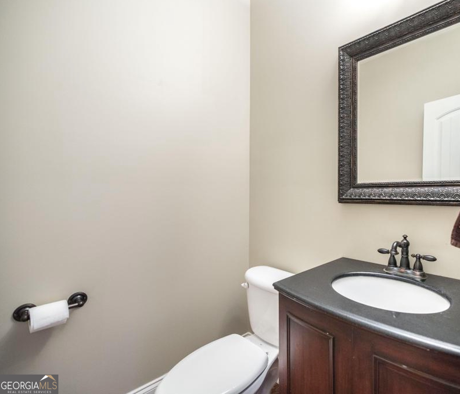 202 Avondale Circle Warner Robins, GA 31088 - Photo 20 of 40 a bathroom with a granite countertop sink toilet and mirror