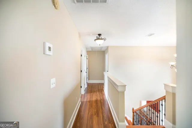a view of a hallway with staircase