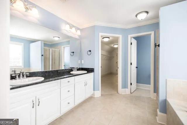 a bathroom with a granite countertop sink mirror and a