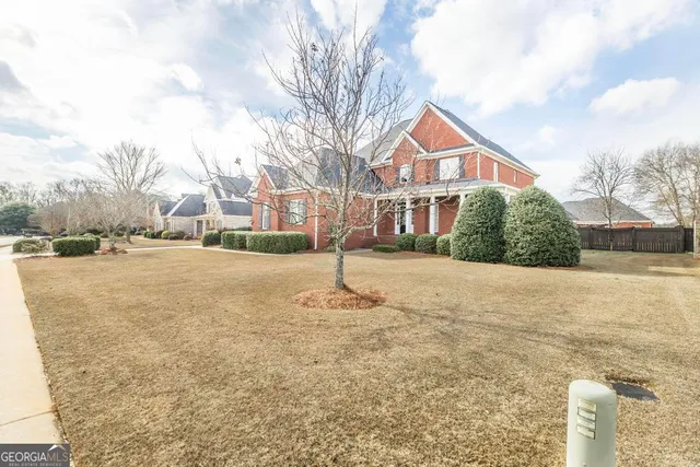 a front view of a house with a yard