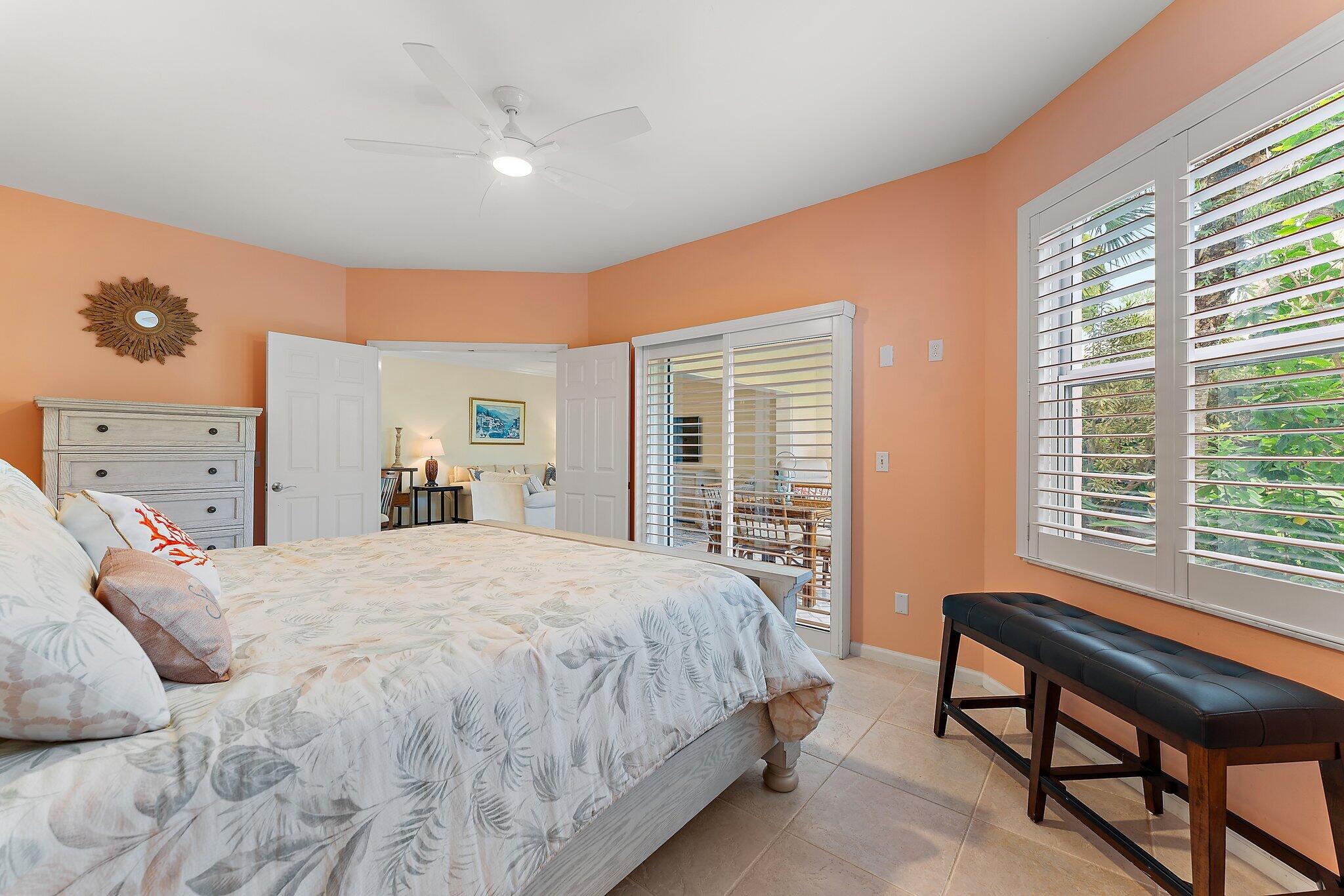 2905 Fairway Drive North Jupiter, FL 33477 - Photo 27 of 65 a bedroom with a bed and a large window