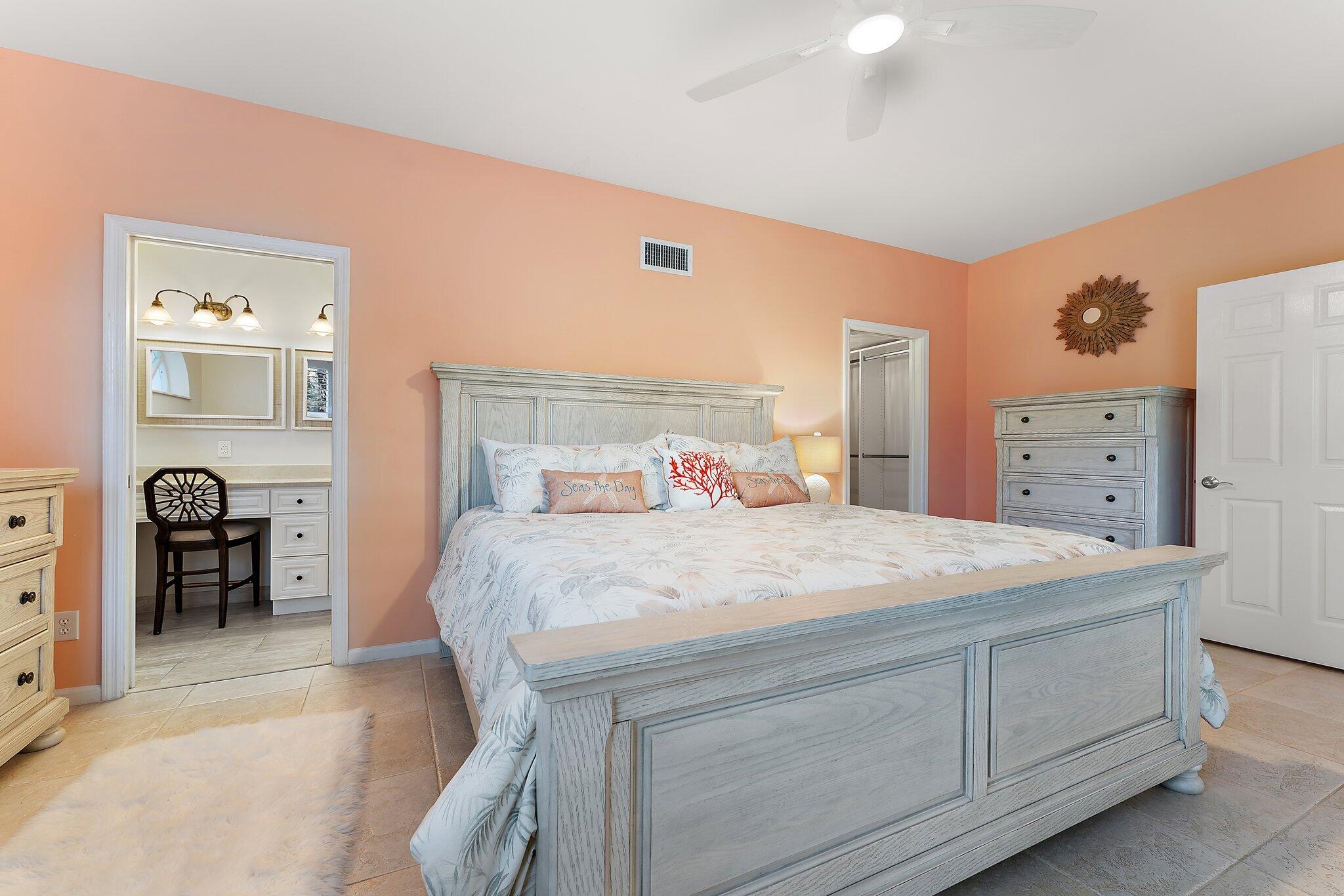 2905 Fairway Drive North Jupiter, FL 33477 - Photo 28 of 65 a bed room with a bed and a table
