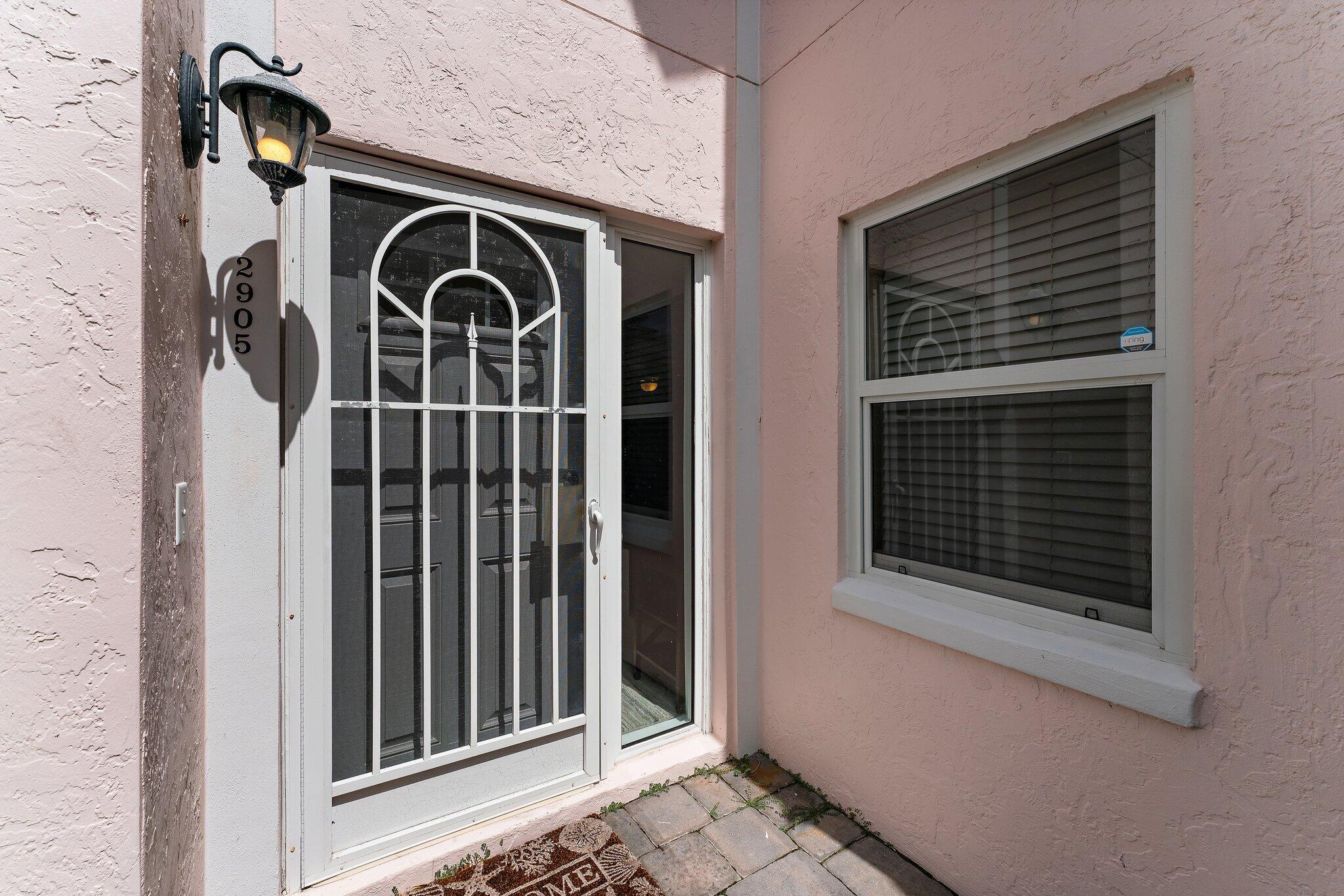2905 Fairway Drive North Jupiter, FL 33477 - Photo 5 of 65 a front view of a house with stairs