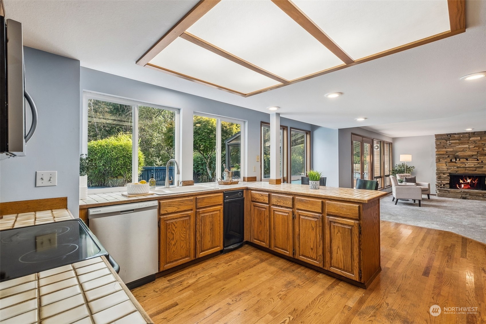 16902 161st Avenue Southeast Renton, WA 98058 - Photo 14 of 29 a large kitchen with stainless steel appliances granite countertop a stove and a sink