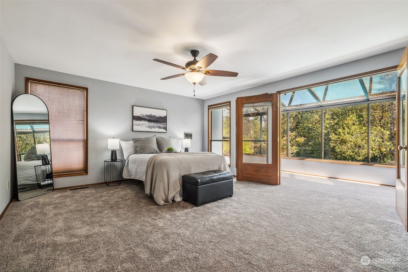16902 161st Avenue Southeast Renton, WA 98058 - Photo 17 of 29 a spacious bedroom with a large bed and a large window