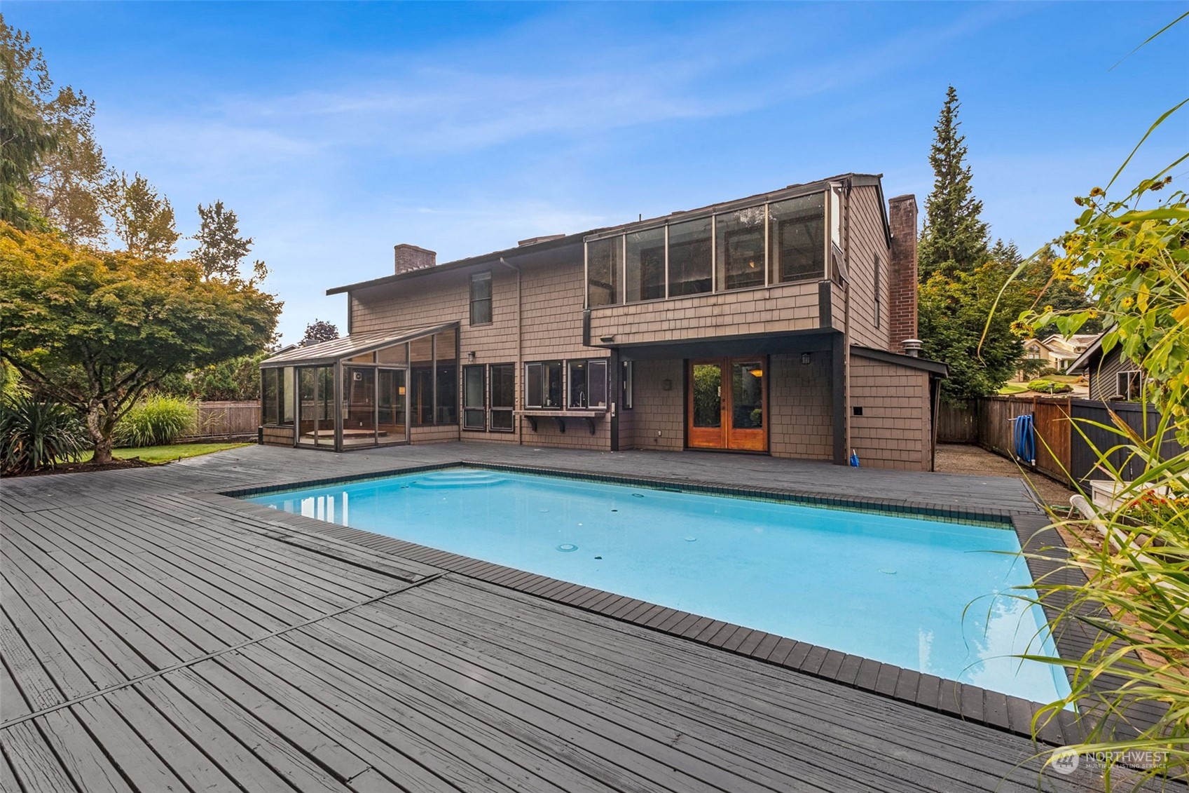 16902 161st Avenue Southeast Renton, WA 98058 - Photo 23 of 29 a view of a house with a swimming pool and sitting area