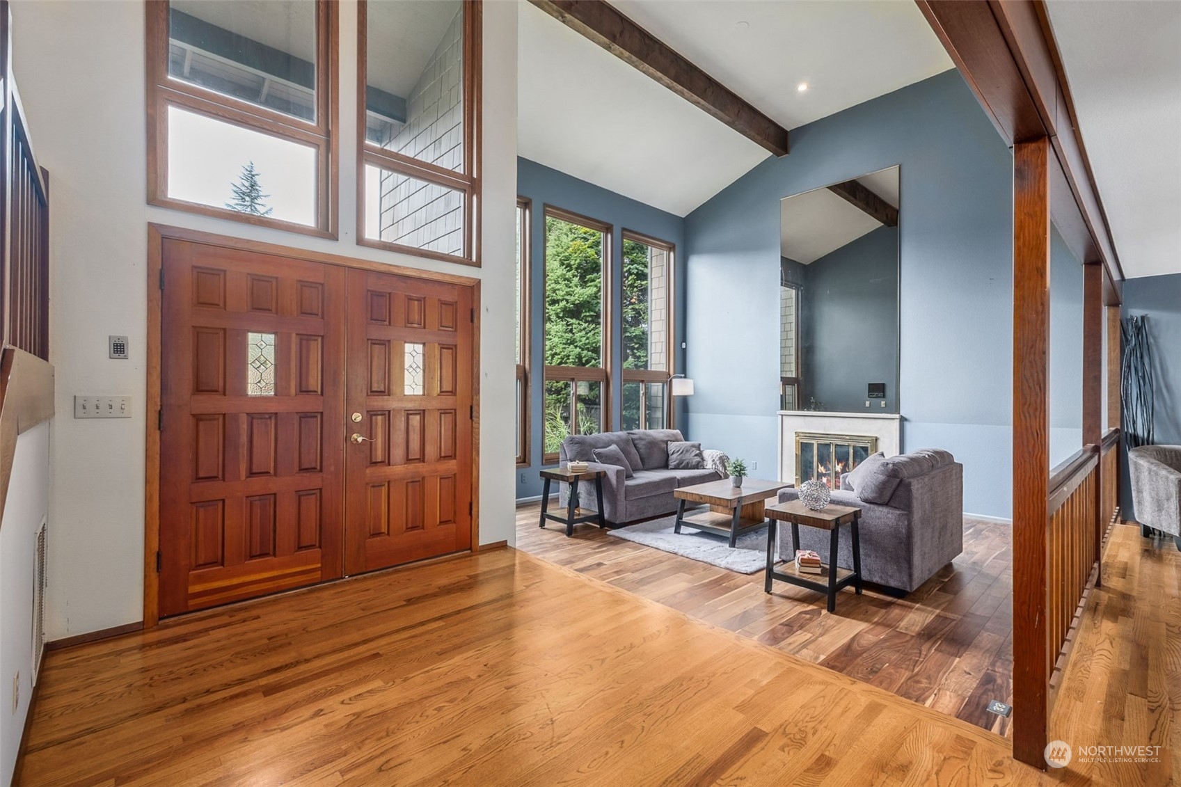 16902 161st Avenue Southeast Renton, WA 98058 - Photo 3 of 29 a living room with furniture and large windows