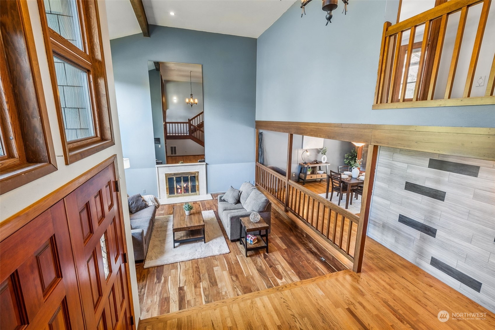 16902 161st Avenue Southeast Renton, WA 98058 - Photo 7 of 29 a view of a porch with wooden floor and furniture