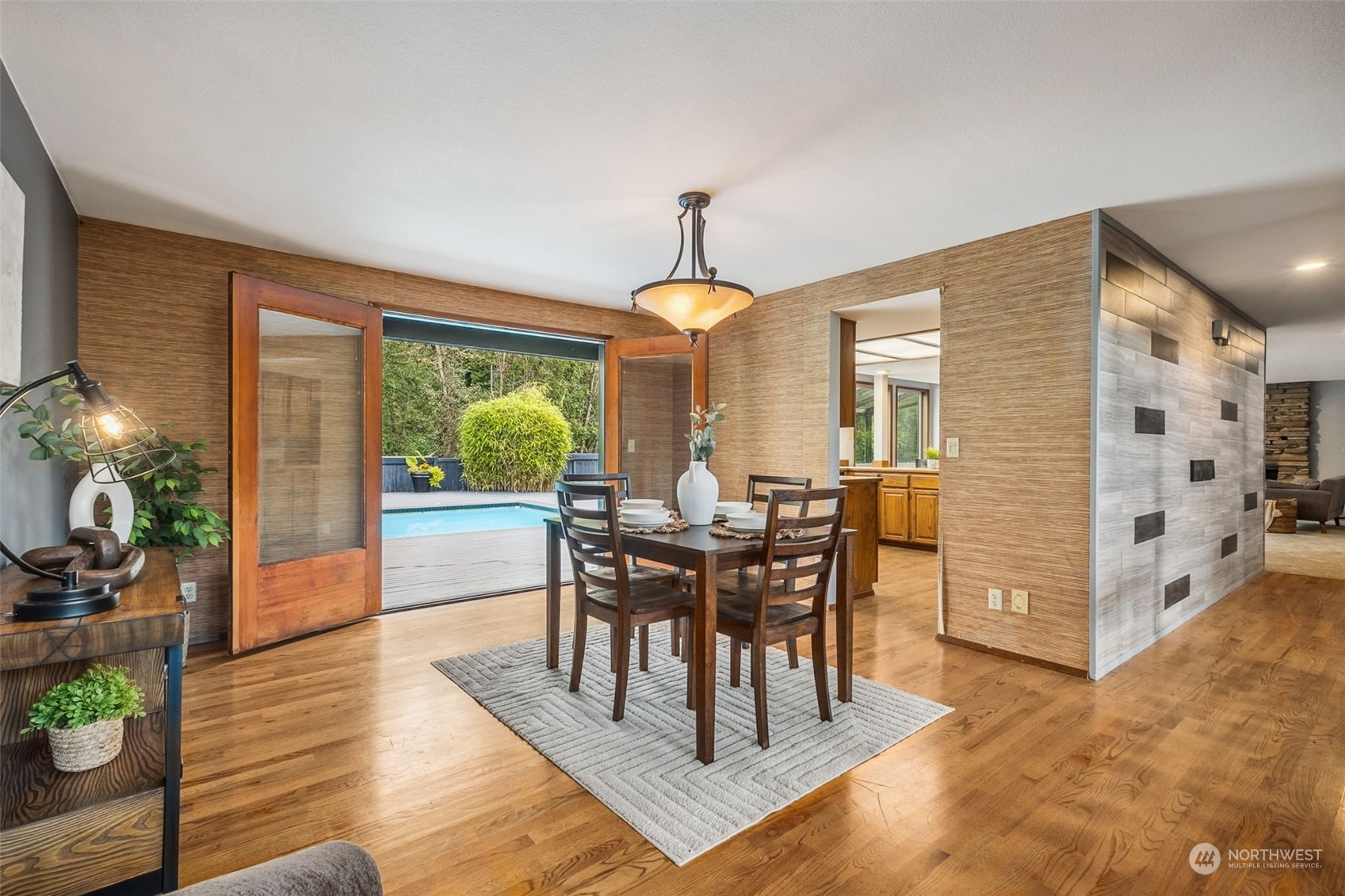 16902 161st Avenue Southeast Renton, WA 98058 - Photo 8 of 29 a view of a dining room with furniture window and wooden floor
