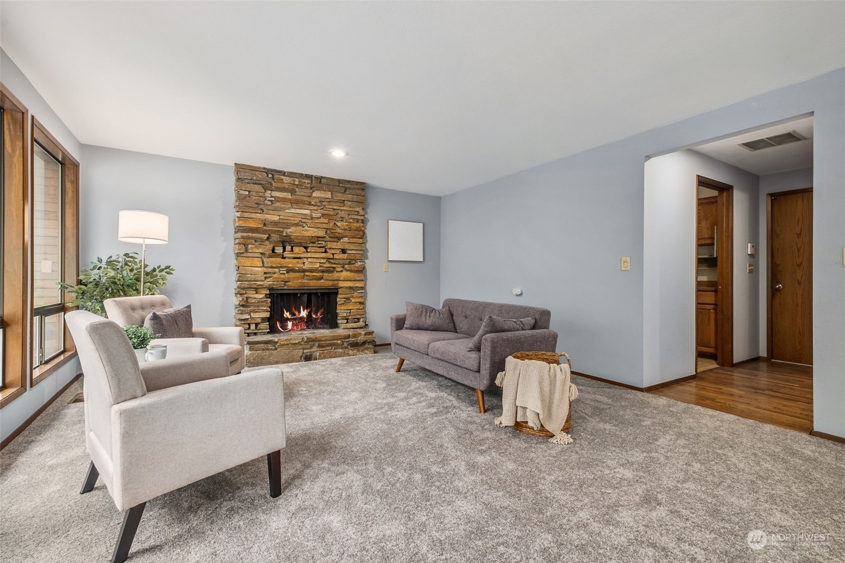 16902 161st Avenue Southeast Renton, WA 98058 - Photo 10 of 29 a living room with furniture and a fireplace