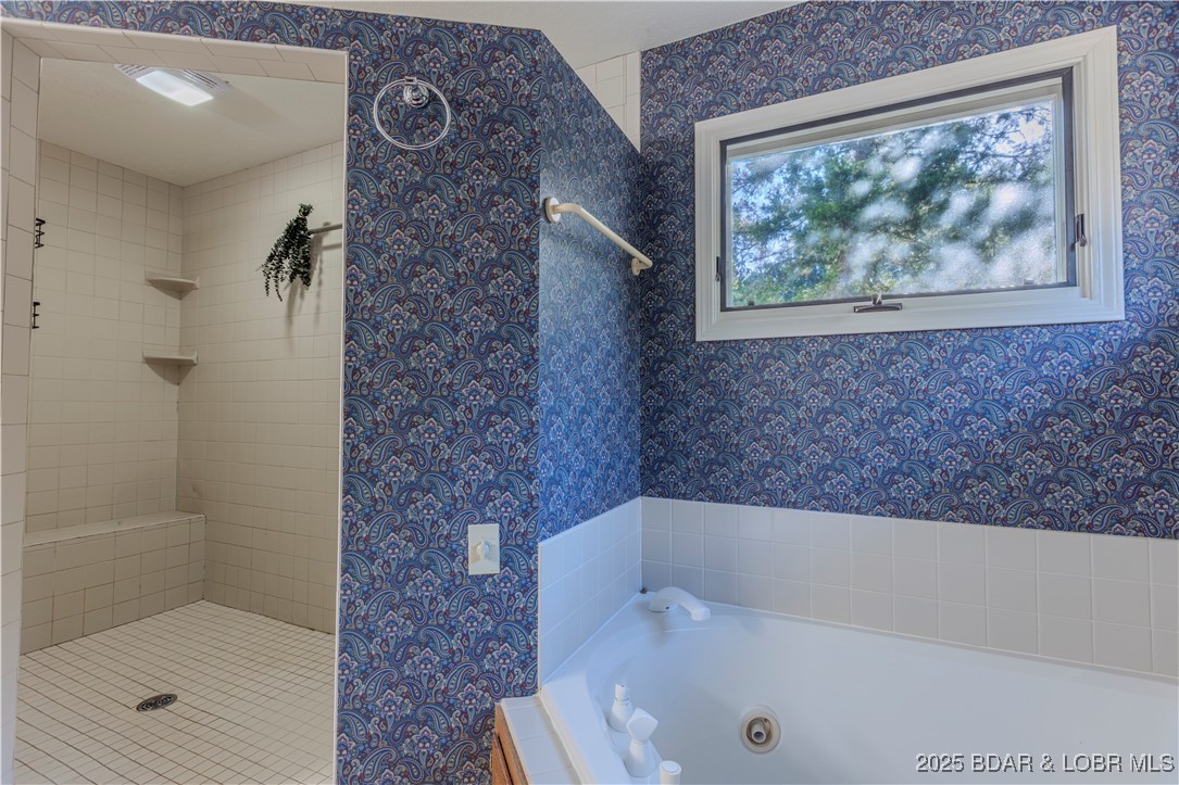 270 Country Club Shores Road Camdenton, MO 65020 - Photo 12 of 26 Double shower heads in walk in shower.