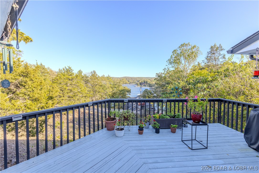270 Country Club Shores Road Camdenton, MO 65020 - Photo 20 of 26 Deck off of the kitchen with a view.