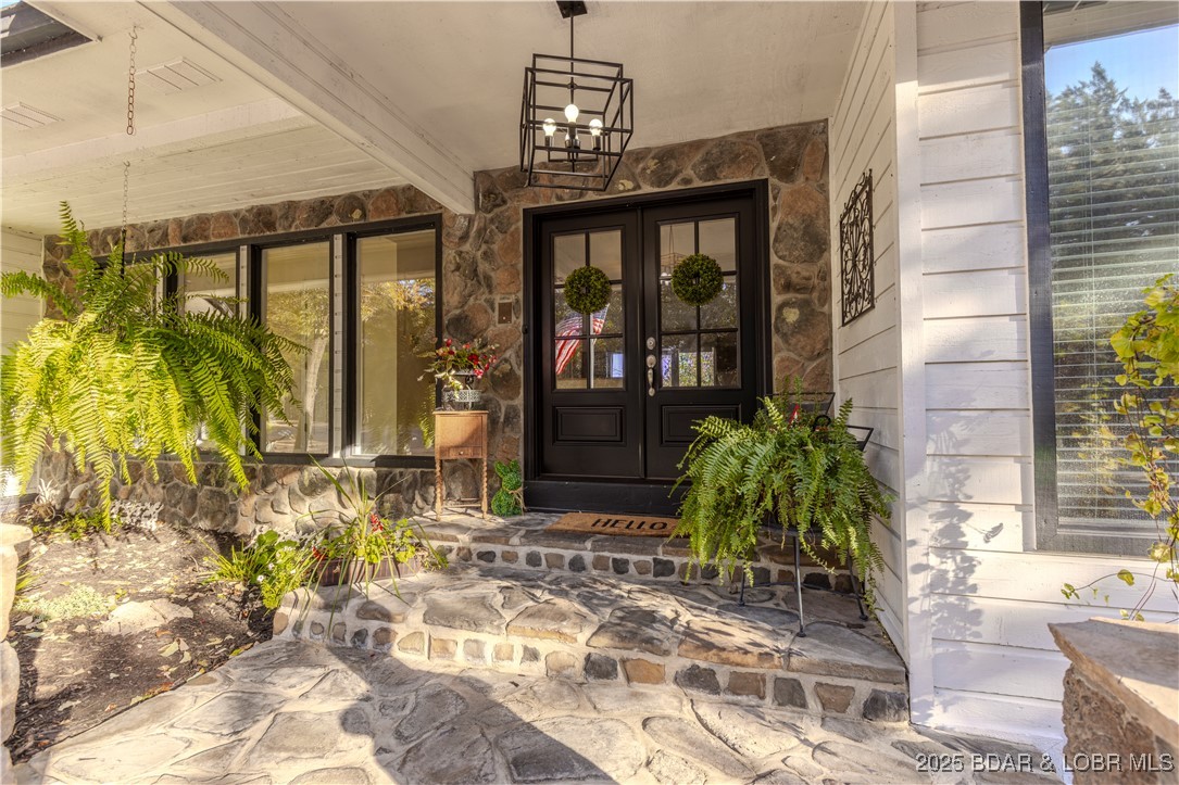 270 Country Club Shores Road Camdenton, MO 65020 - Photo 2 of 23 The new front doors and stonework set the tone fro