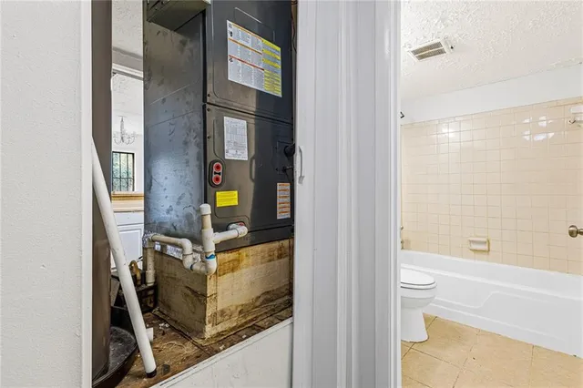 a bathroom with a bathtub and shower