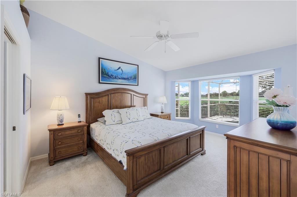 6667 Castlelawn Place, Unit 19 Naples, FL 34113 - Photo 14 of 31 a bedroom with a bed and window