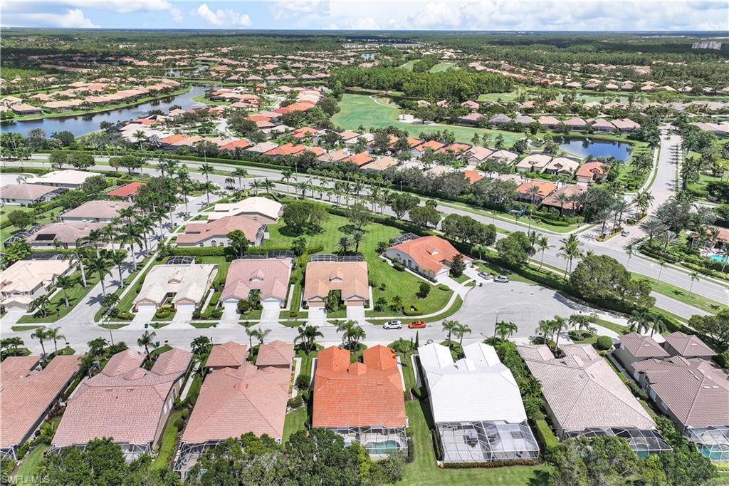 6667 Castlelawn Place, Unit 19 Naples, FL 34113 - Photo 27 of 31 an aerial view of residential houses with outdoor space