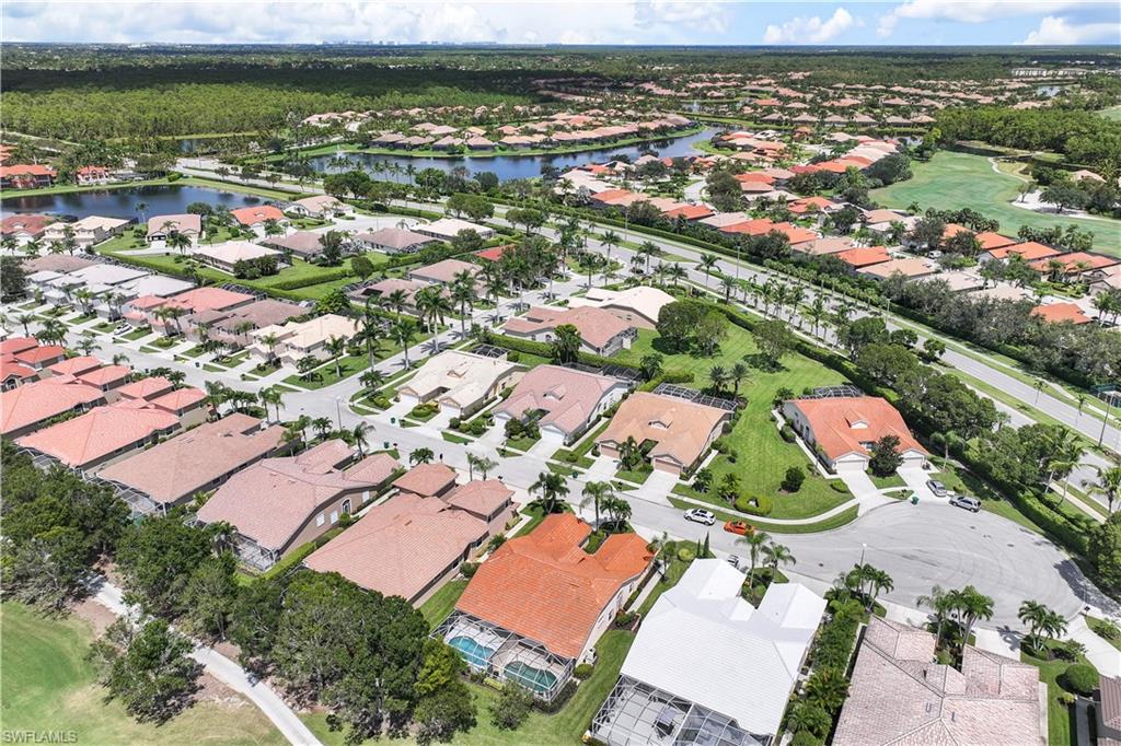 6667 Castlelawn Place, Unit 19 Naples, FL 34113 - Photo 28 of 31 an aerial view of residential houses with outdoor space