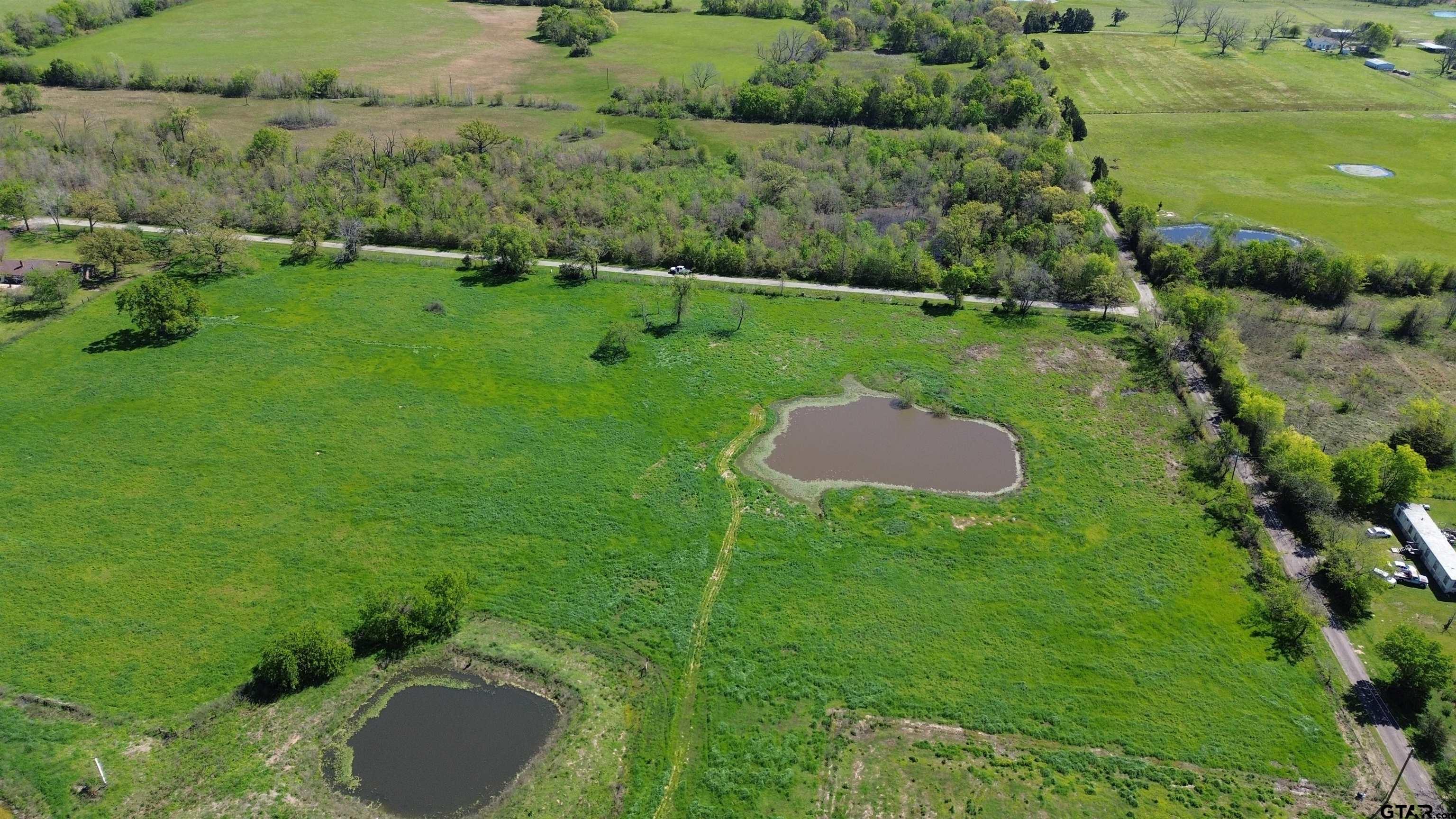 Lot 1 Rscr 3417 Emory, TX 75440 - Photo 12 of 30 a backyard of a house with a yard and lake view