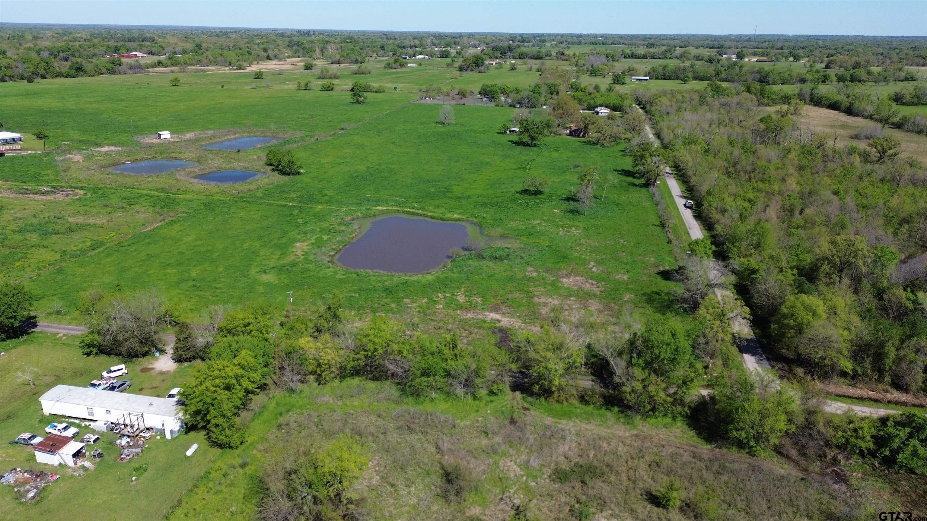 Lot 1 Rscr 3417 Emory, TX 75440 - Photo 7 of 30 a view of a lush green outdoor space with a swimming pool