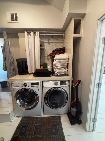 a view of a livingroom with furniture and a window
