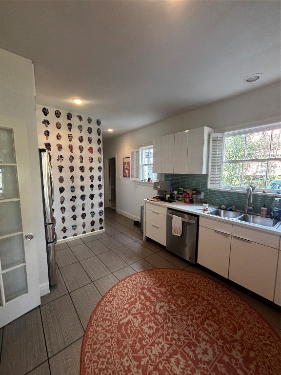 917 East 39th Street Austin, TX 78751 - Photo 19 of 27 a kitchen with granite countertop a refrigerator and white cabinets