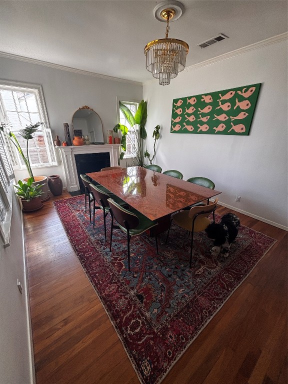 917 East 39th Street Austin, TX 78751 - Photo 22 of 27 a view of a dining room with furniture a chandelier and wooden floor