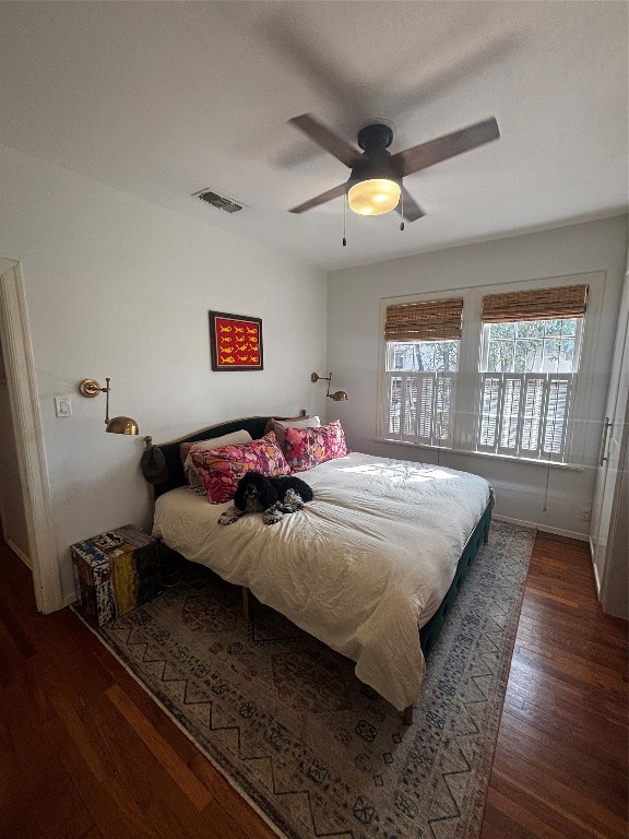 917 East 39th Street Austin, TX 78751 - Photo 4 of 27 a bed sitting in a bedroom next to a window