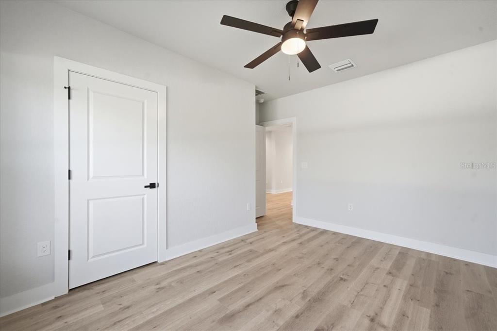 15212 Hawley Road Weeki Wachee, FL 34614 - Photo 21 of 25 wooden floor in an empty room