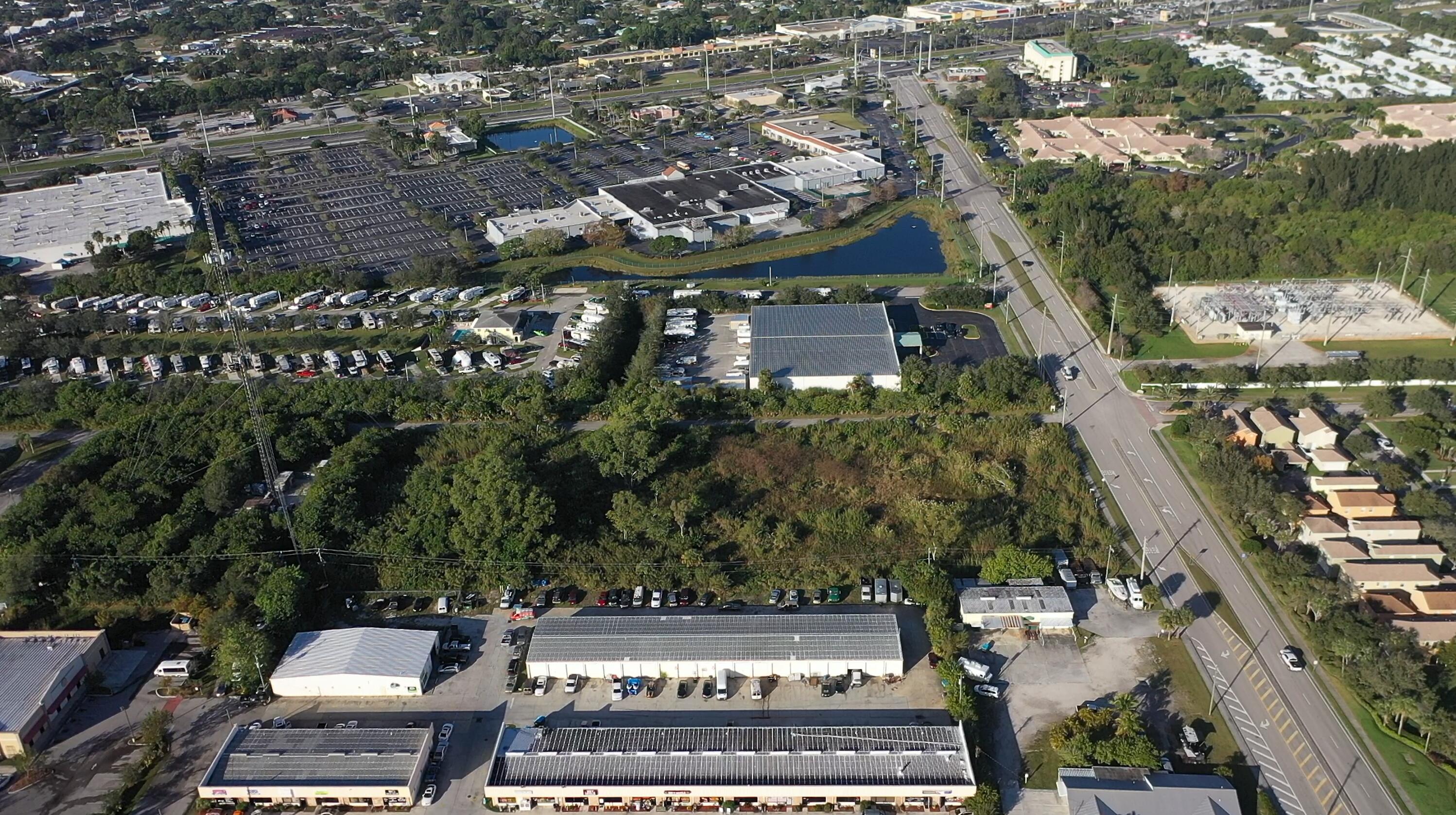 3775 Southeast Jennings Road Port St. Lucie, FL 34952 - Photo 11 of 14 an aerial view of a residential apartment building with a yard